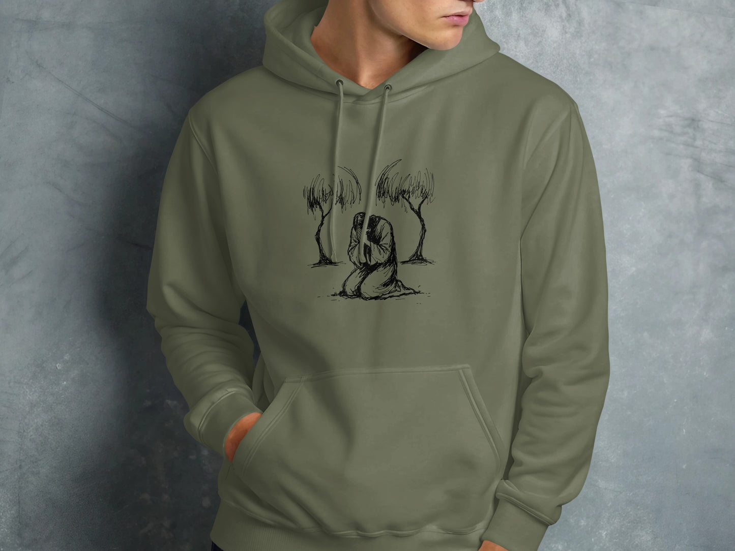 Hoodie with a sketch of a person kneeling between two trees.