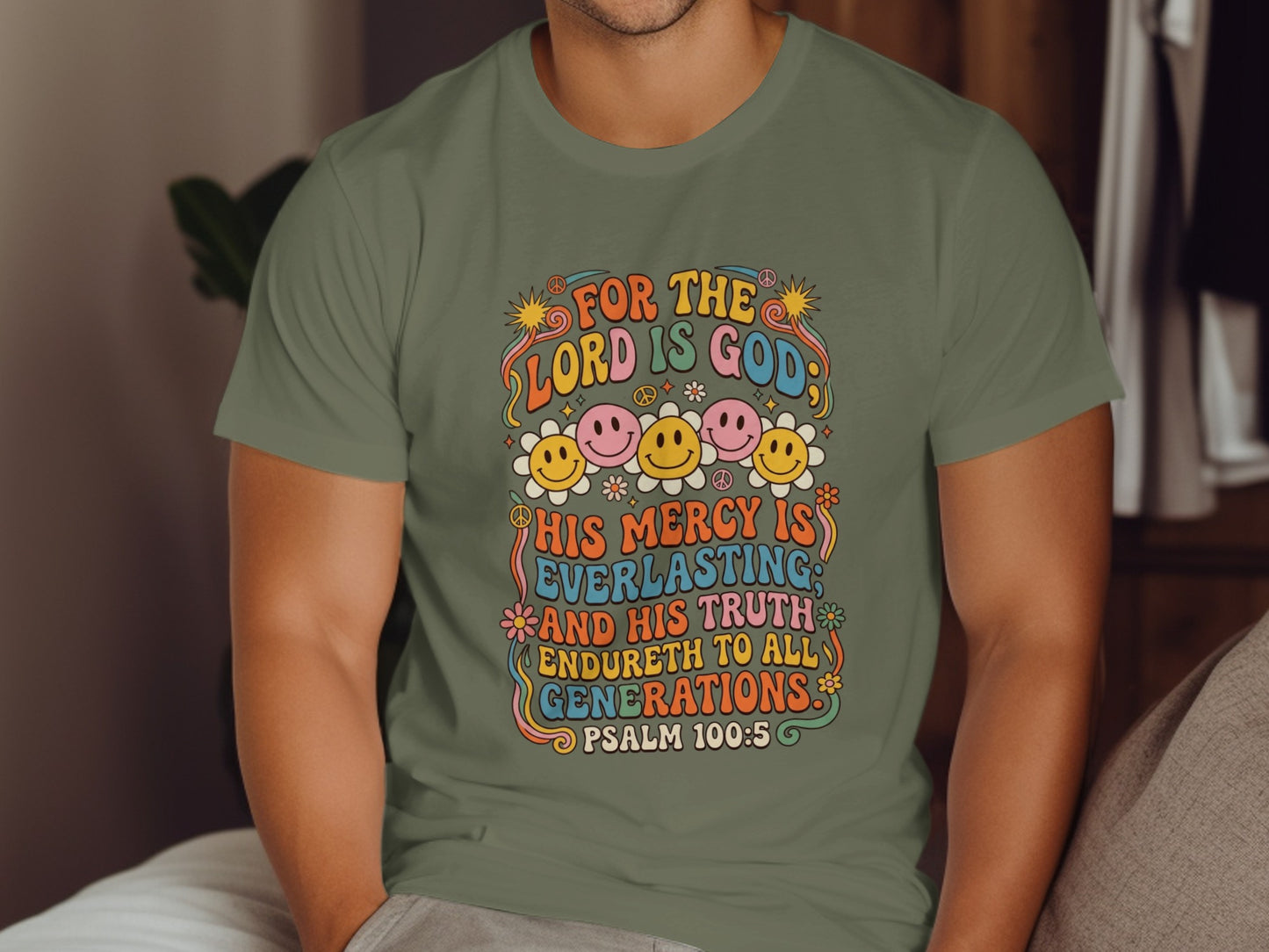 Olive green t-shirt with "For the Lord is God, His Mercy is Everlasting" text and smiling faces.