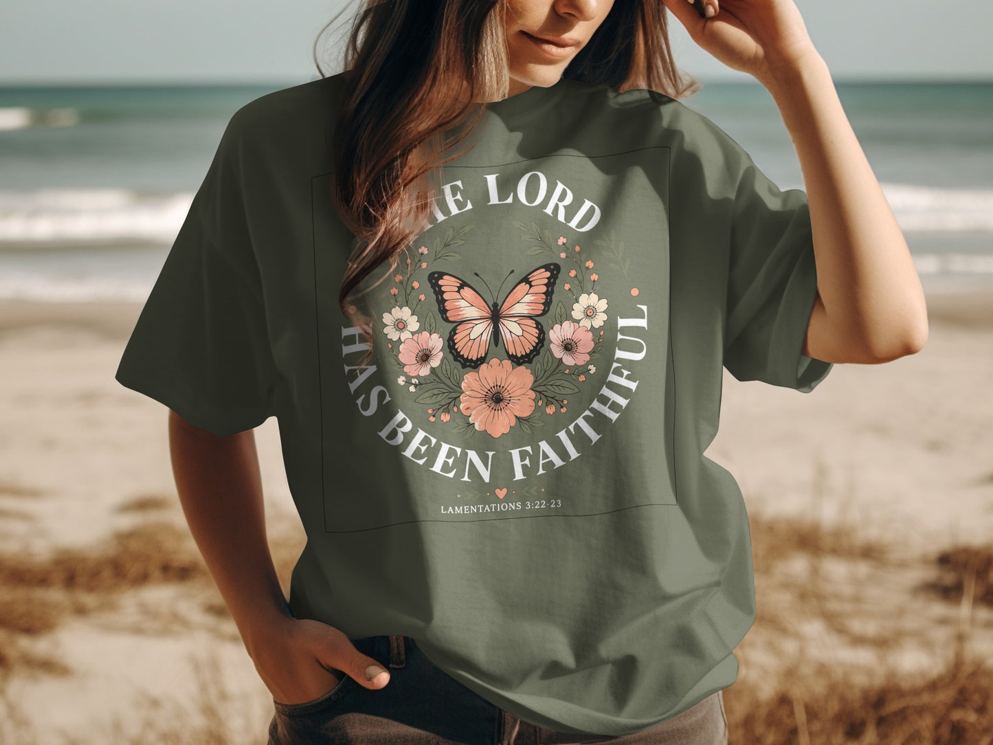 Green t-shirt with "The Lord has been faithful" and butterflies graphic.