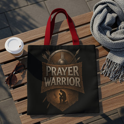 Black tote bag with "Prayer Warrior" text, kneeling figure, shield, and arrows design.
