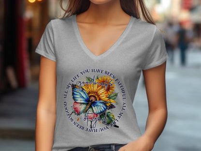Grey v-neck t-shirt with a circular design featuring sunflowers and a butterfly.