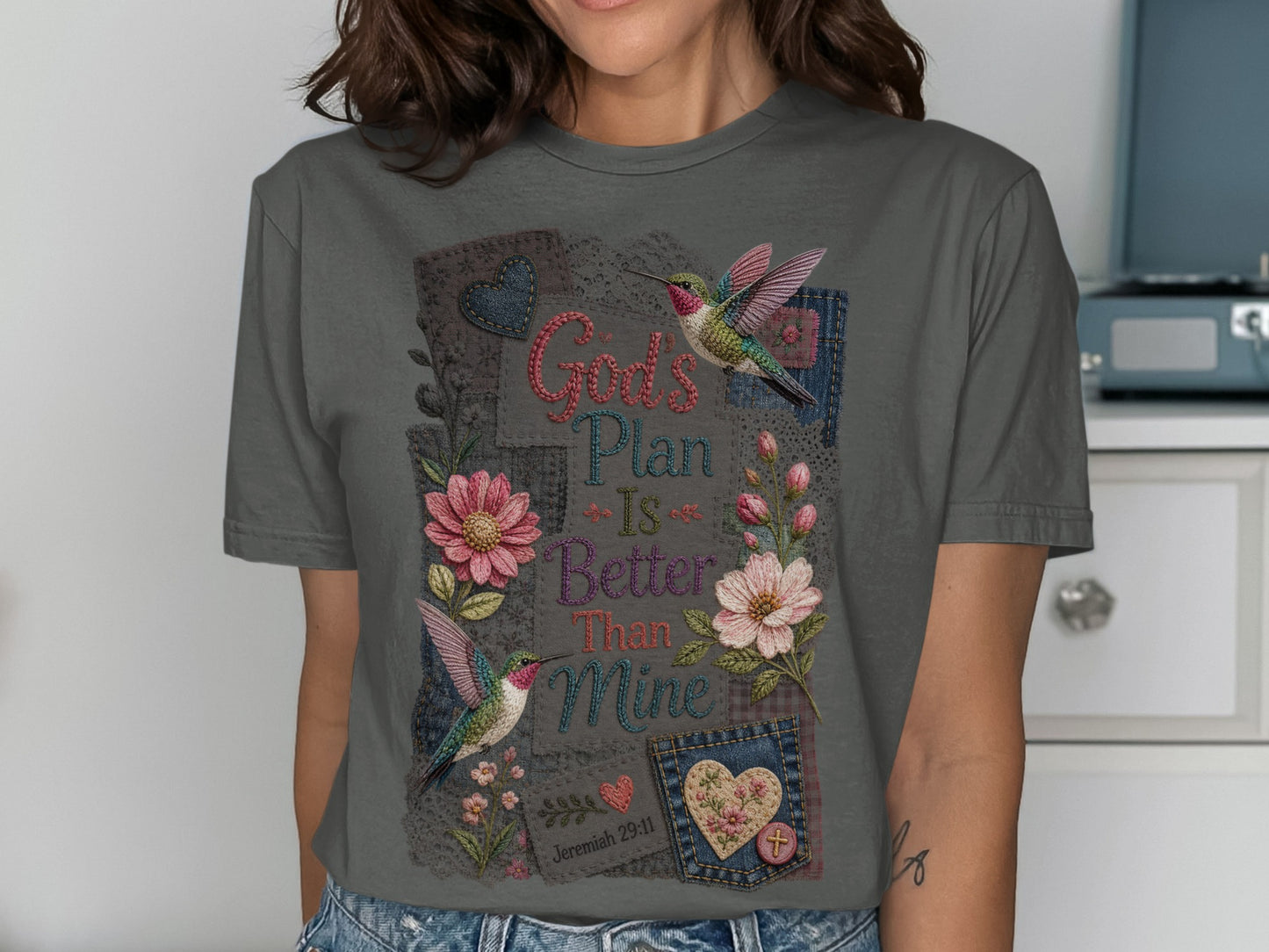 Gray t-shirt with hummingbirds, flowers, and "God's Plan Is Better Than Mine" text.