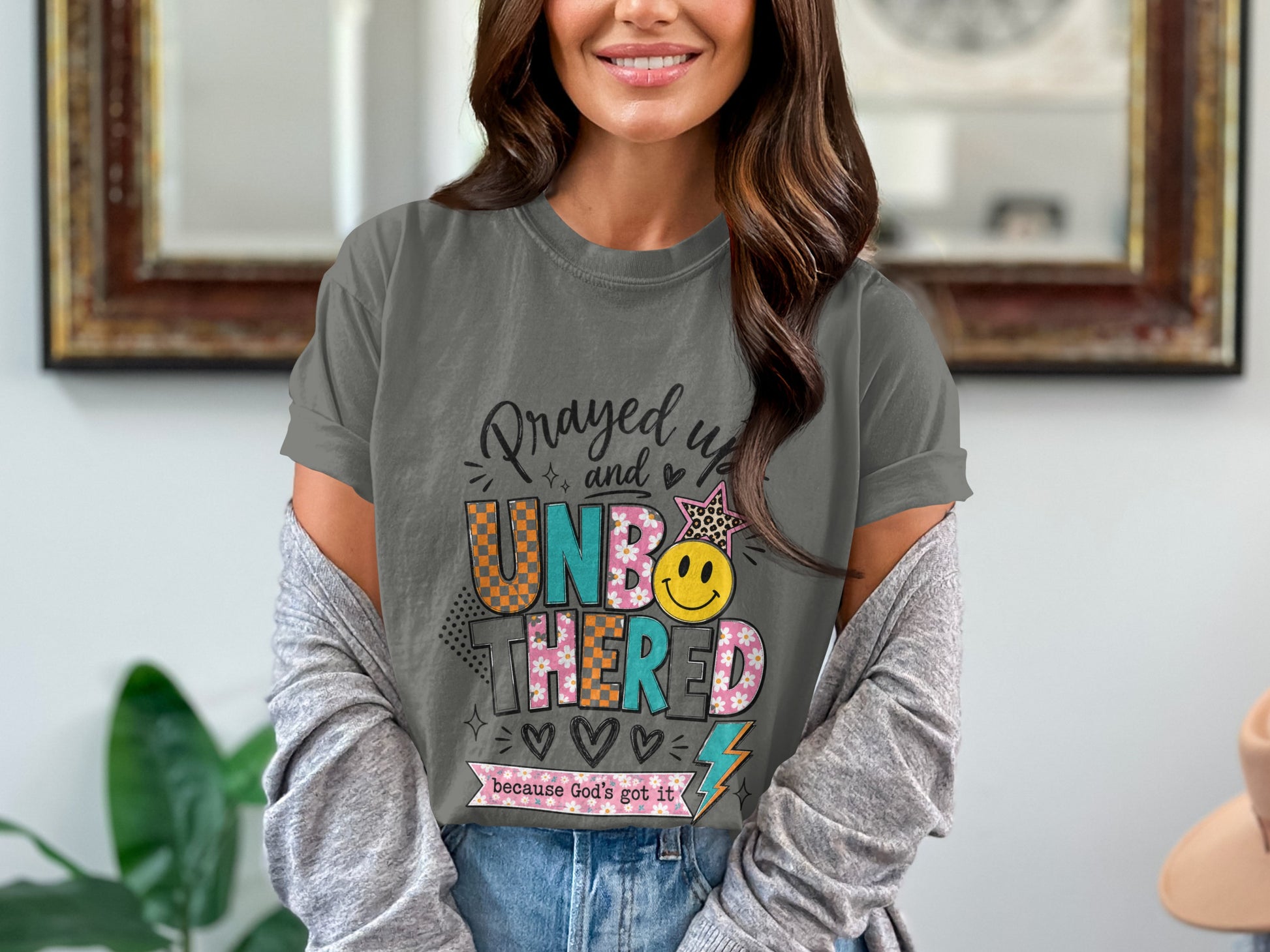 Gray t-shirt with "Prayed up and UNBOTHERED because God's got it" text.