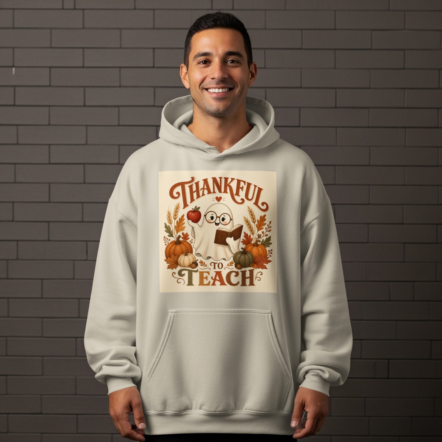 Ghost holding apple and book with pumpkins and text "Thankful to Teach".