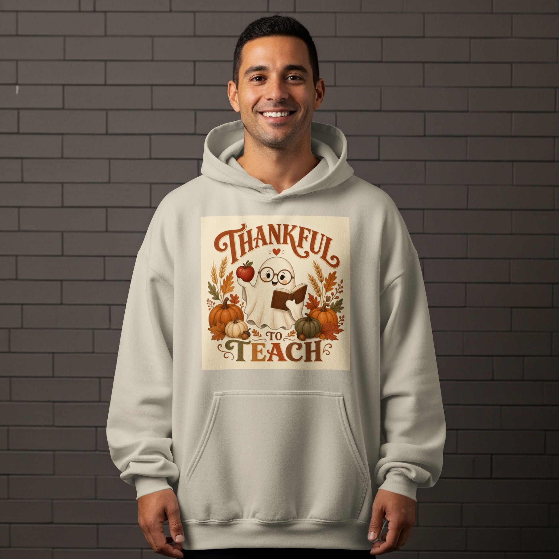 Ghost holding apple and book with pumpkins and text "Thankful to Teach".