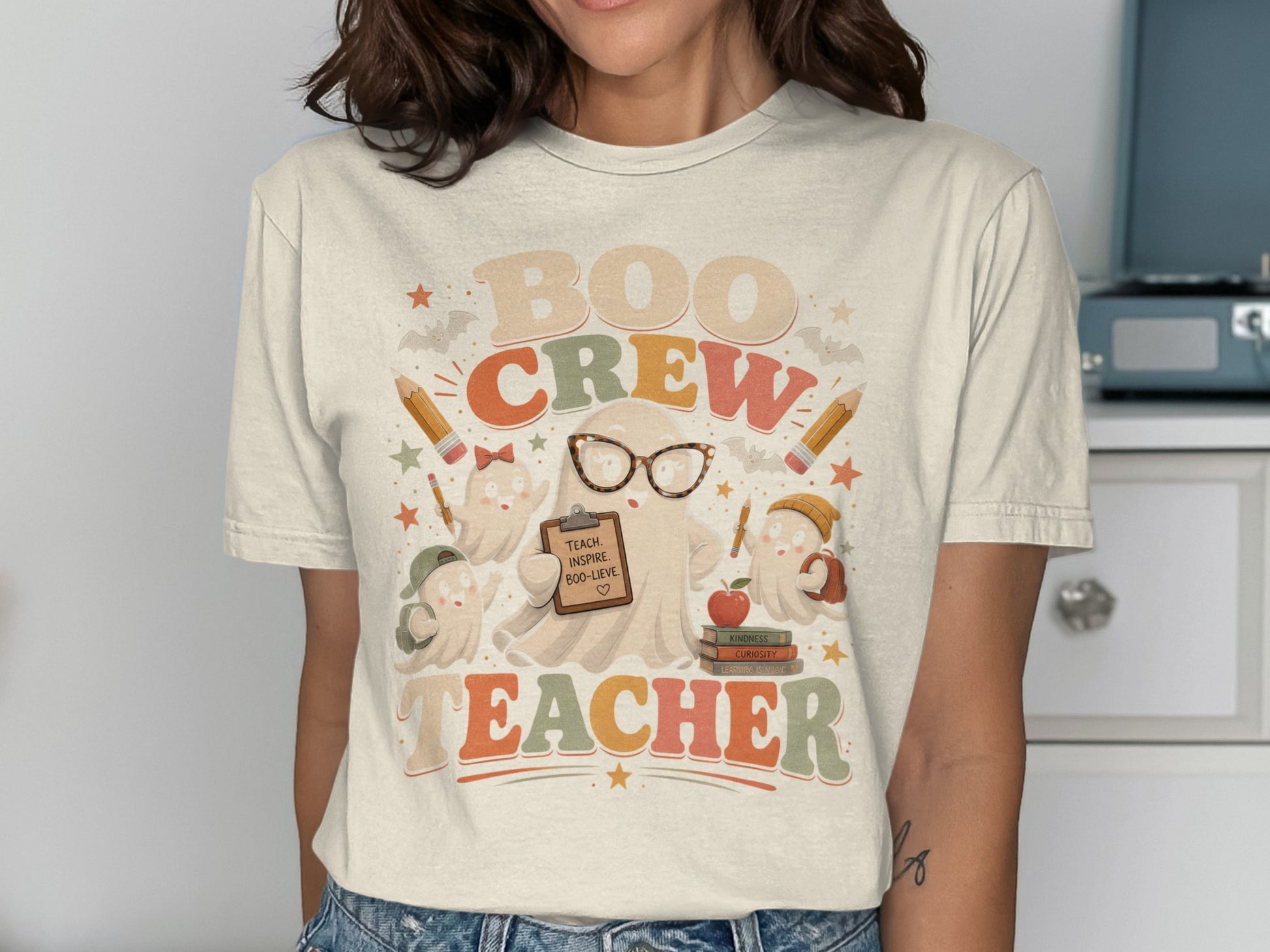 "Boo Crew Teacher" graphic with ghosts, pencils, books, and text.