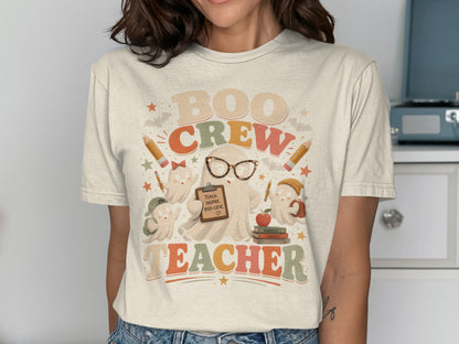 "Boo Crew Teacher" graphic with ghosts, pencils, books, and text.