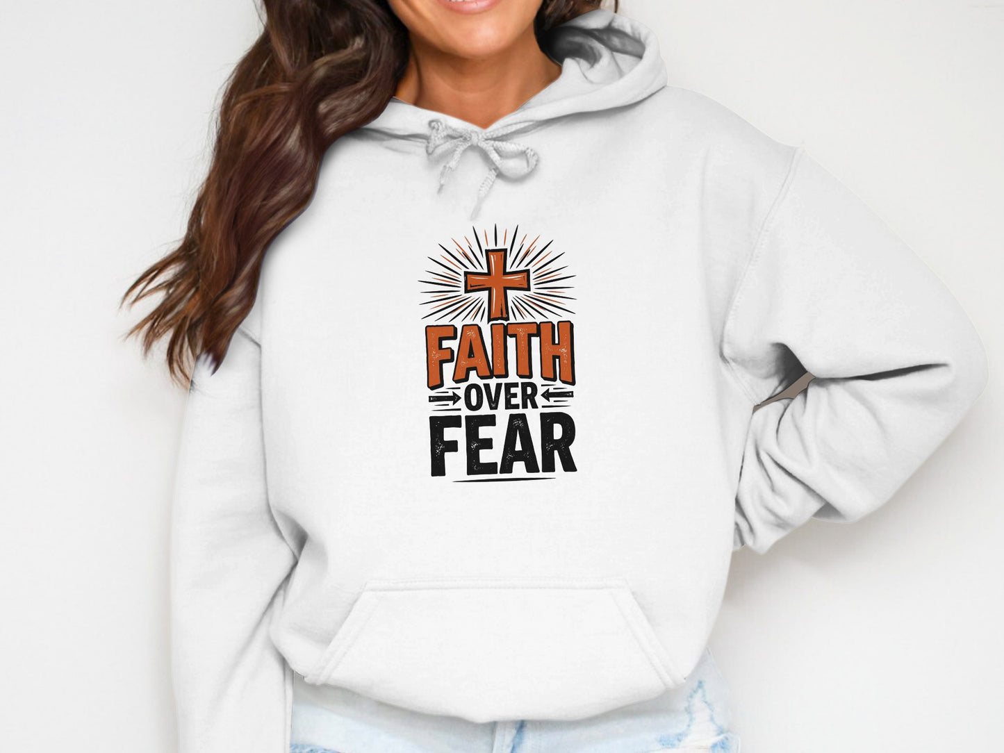 White hoodie with "Faith Over Fear" text and a cross design.