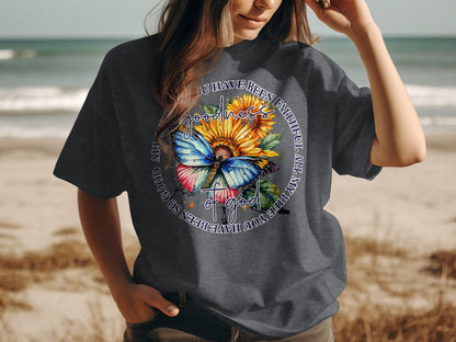 Dark gray t-shirt with sunflower, butterfly, and religious text design.