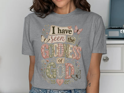 Gray t-shirt with "I have seen the goodness of God" in colorful, patterned letters.