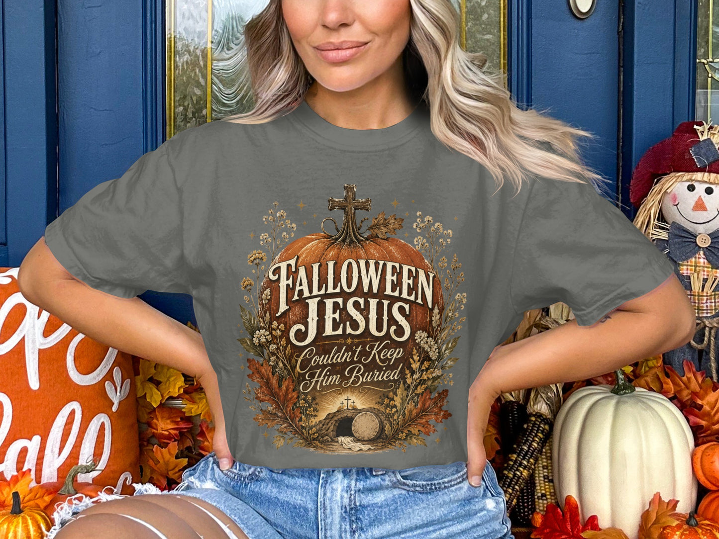 "Hallowen Jesus Couldn't Keep Him Buried" graphic on a grey t-shirt.