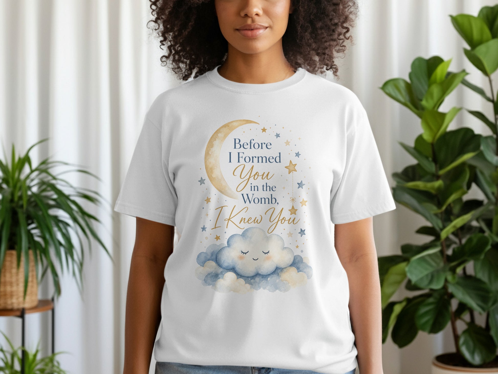 White t-shirt with celestial design and text: "Before I Formed You in the Womb, I Knew You."
