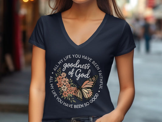 Dark blue t-shirt with "goodness of God" and butterfly design.