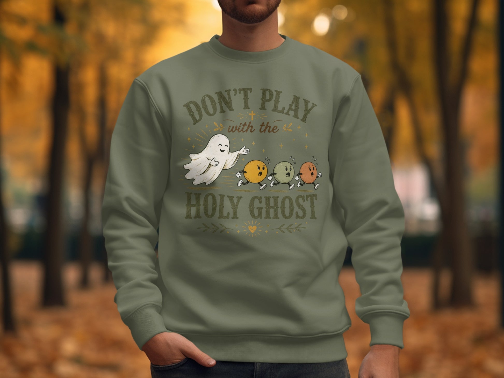 Crewneck sweatshirt with "Don't Play With the Holy Ghost" graphic featuring a ghost and running eggs.