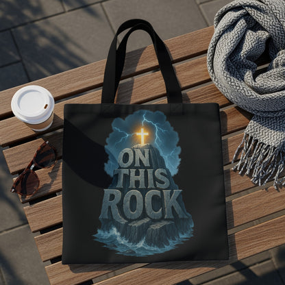 Black tote bag with Christian graphic "On This Rock" and glowing cross