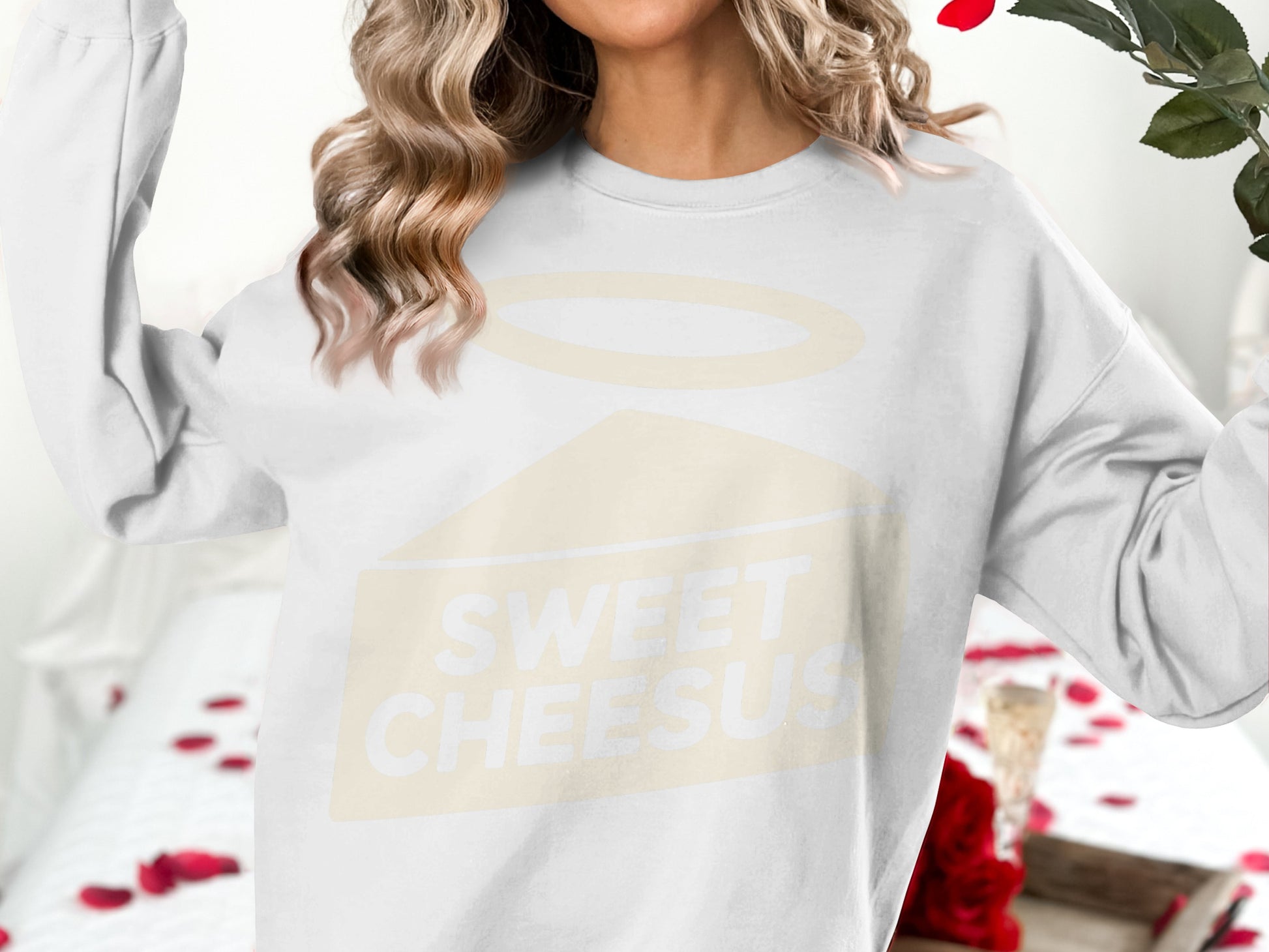 White crewneck sweatshirt with "SWEET CHEESUS" text and halo graphic.