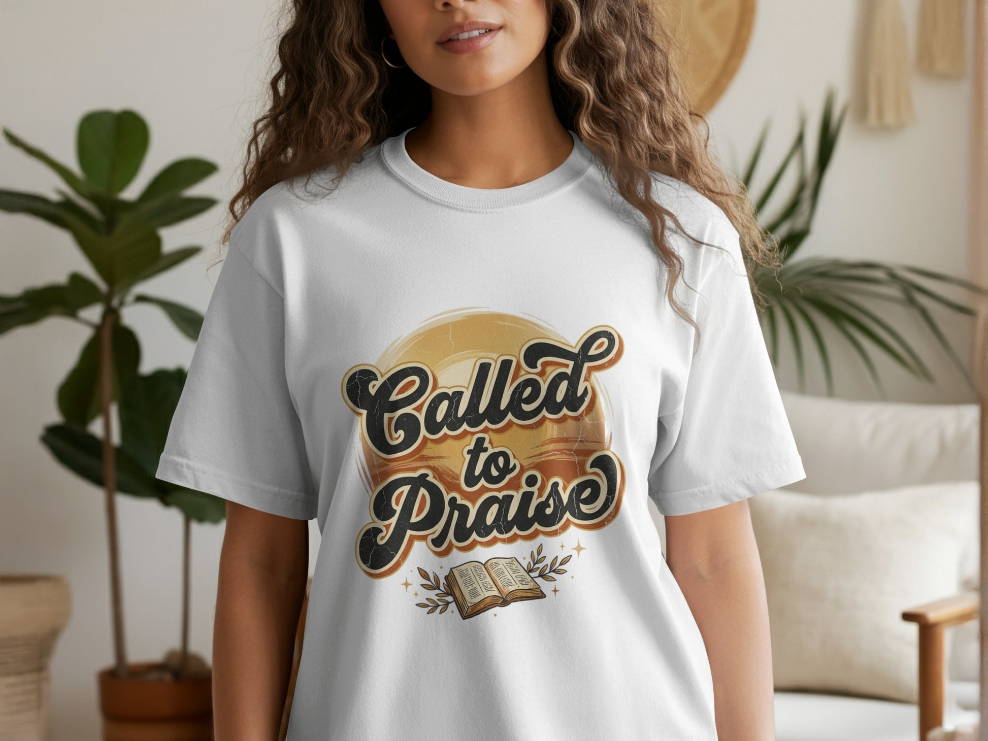 White t-shirt with "Called to Praise" text and open book graphic.