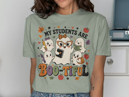 "My students are Boo-tiful" text with cute ghosts holding school supplies and wearing a bow.