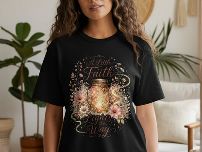 Black t-shirt with floral design and text "A Little Faith Lights the Way".
