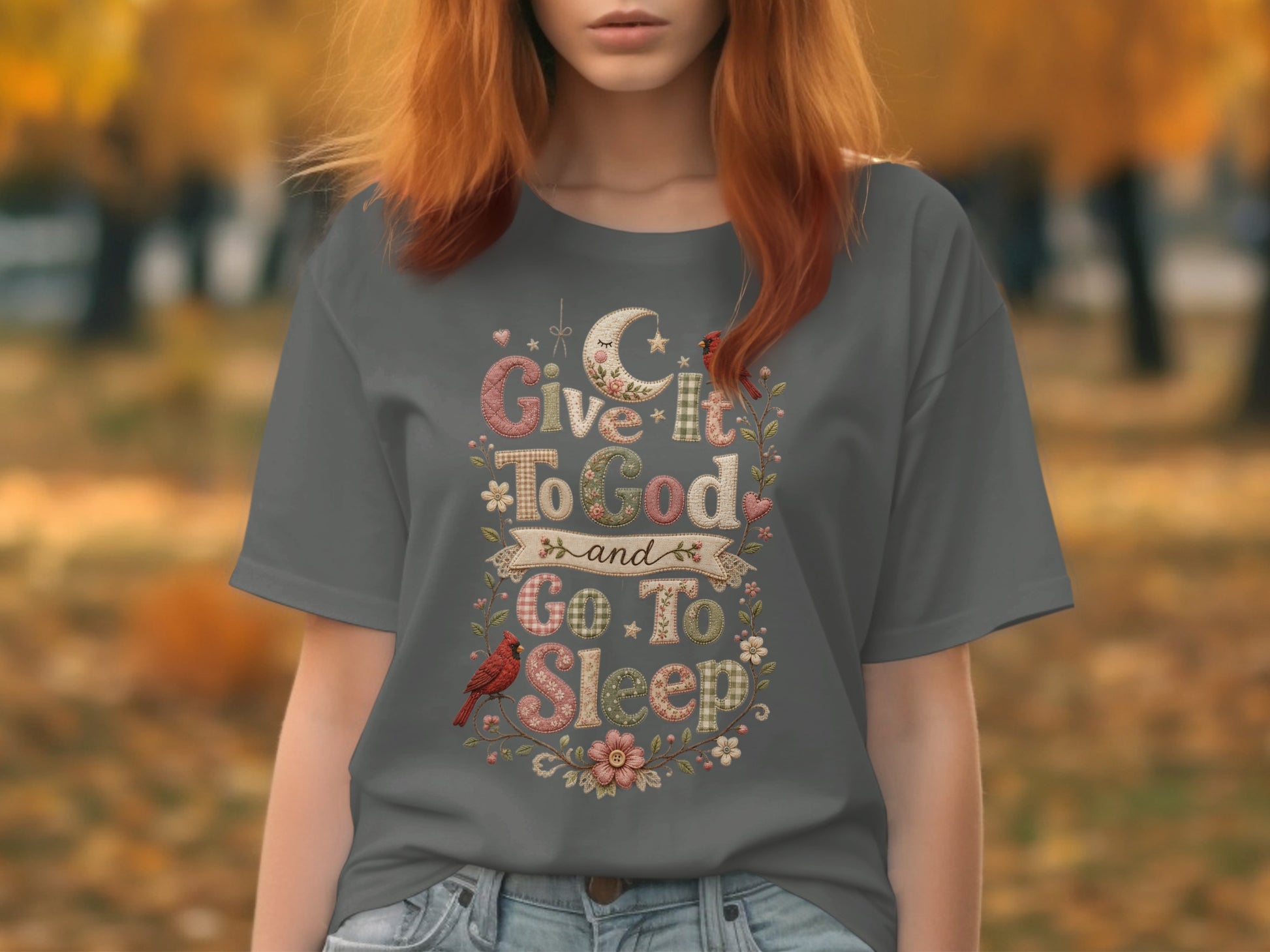 Gray t-shirt with text "Give It To God and Go To Sleep" and floral accents.