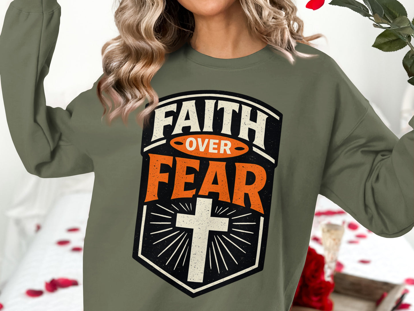 Olive sweatshirt with "Faith Over Fear" text and a cross graphic.