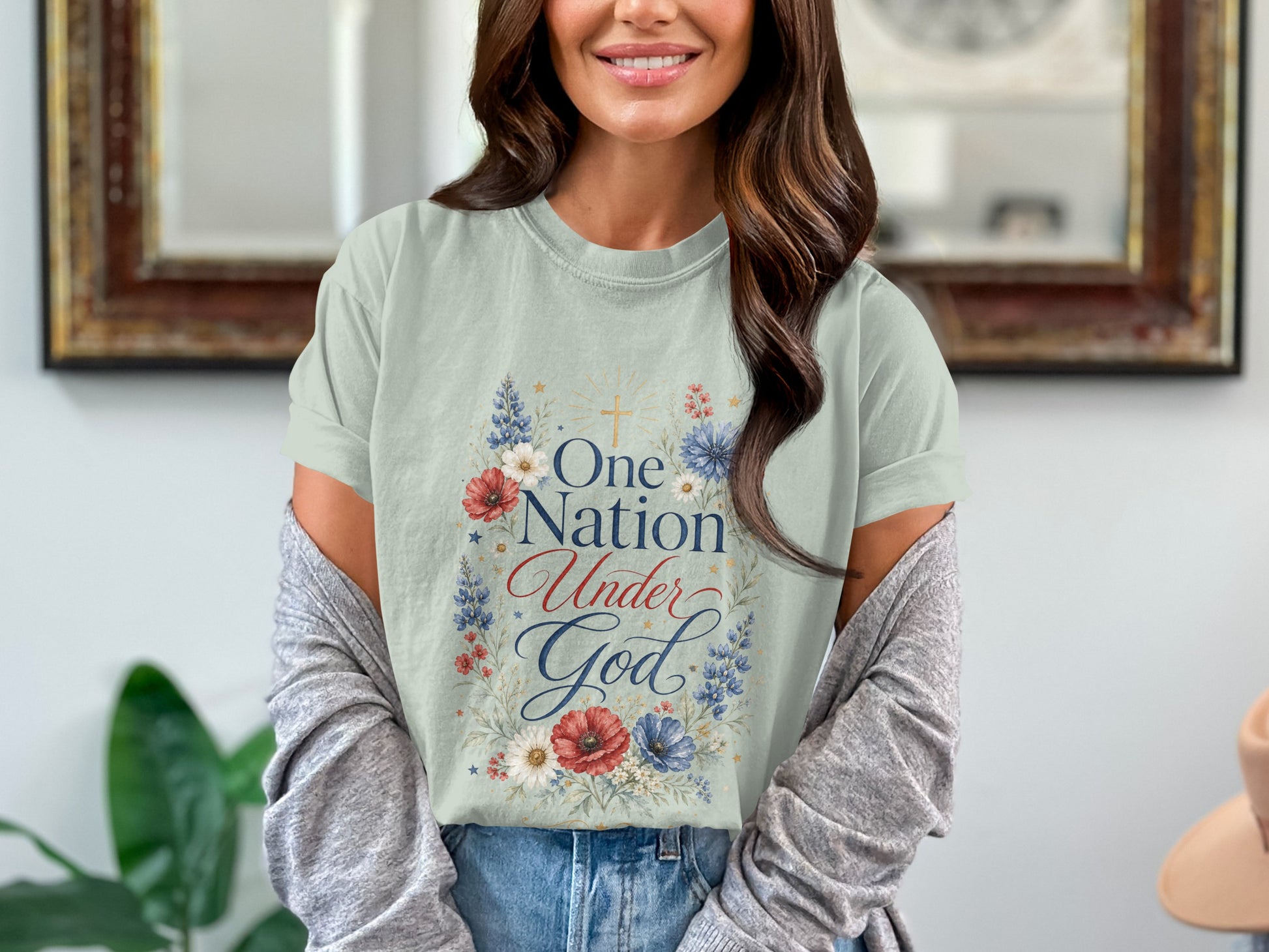 Light green t-shirt with "One Nation Under God" text and floral design.