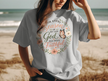 Light gray t-shirt with "For Every Season of My Life God Has Been Faithful" text and floral wreath.