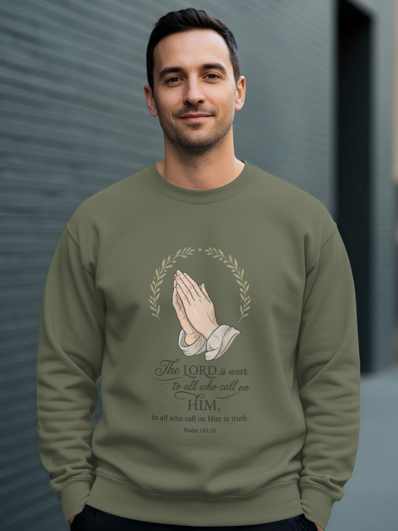 Olive sweatshirt with praying hands and Psalm 145:18 text.