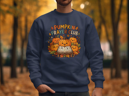 Navy sweatshirt with "Pumpkin Prayer Club" and pumpkins on an open Bible.