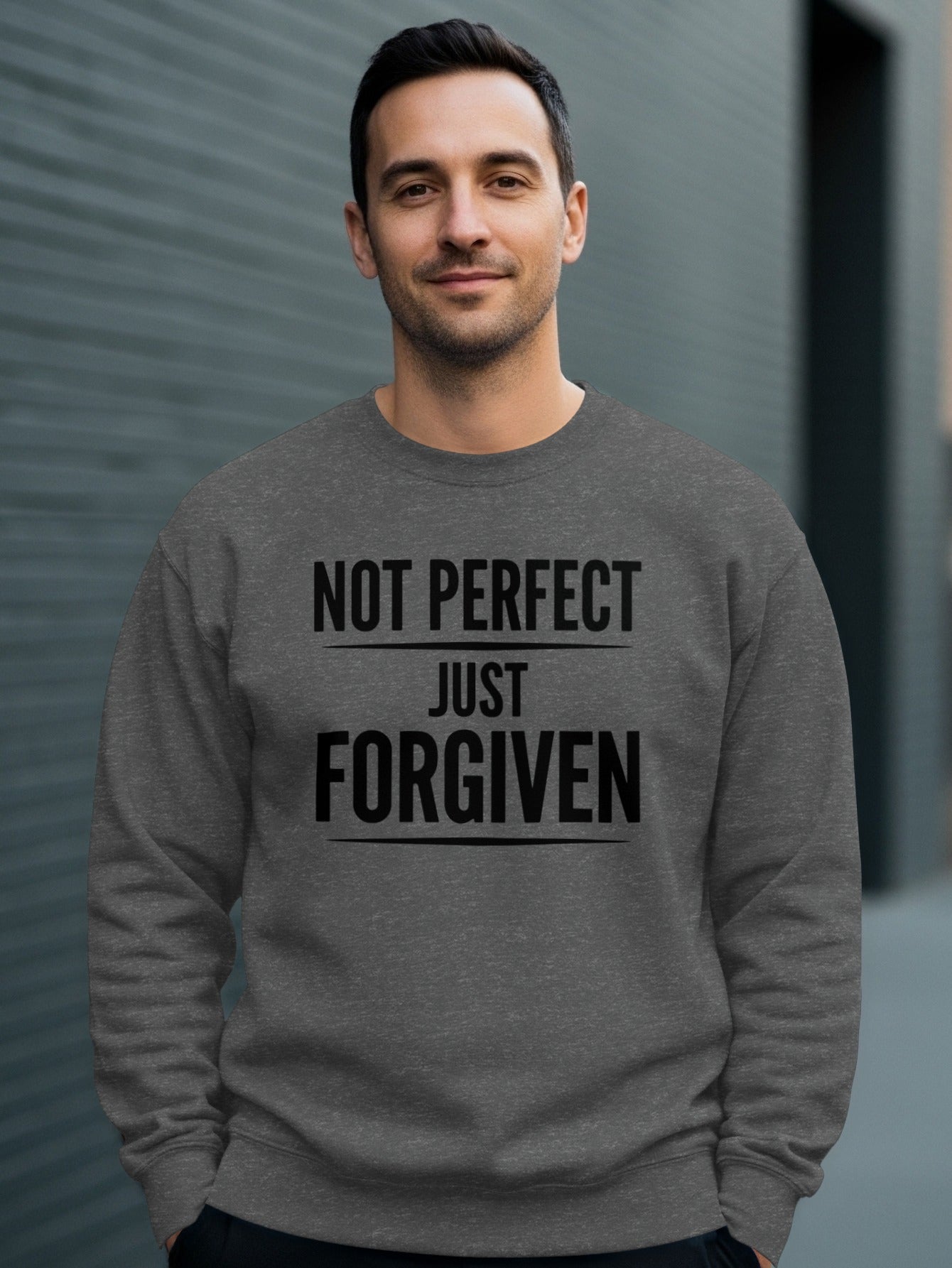 Dark gray crewneck sweatshirt with "NOT PERFECT JUST FORGIVEN" text.
