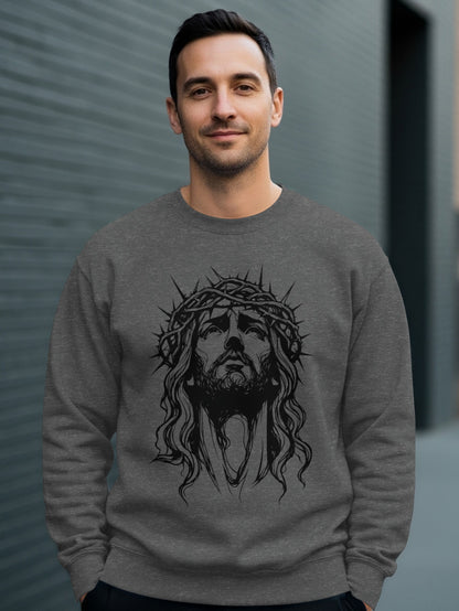Man wearing a crewneck sweatshirt with a charcoal drawing of Jesus' face.