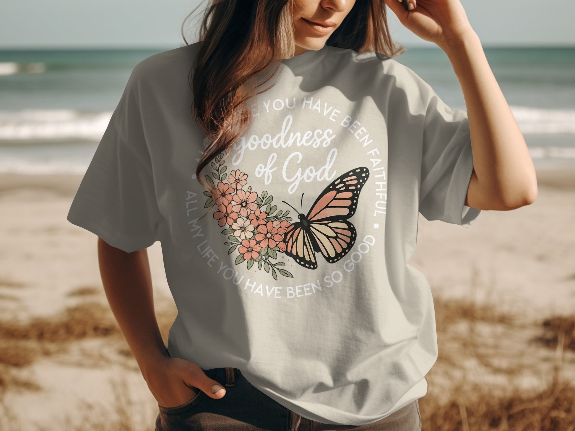 Gray t-shirt with butterfly and floral design, text says "Goodness of God All my life you have been so good".