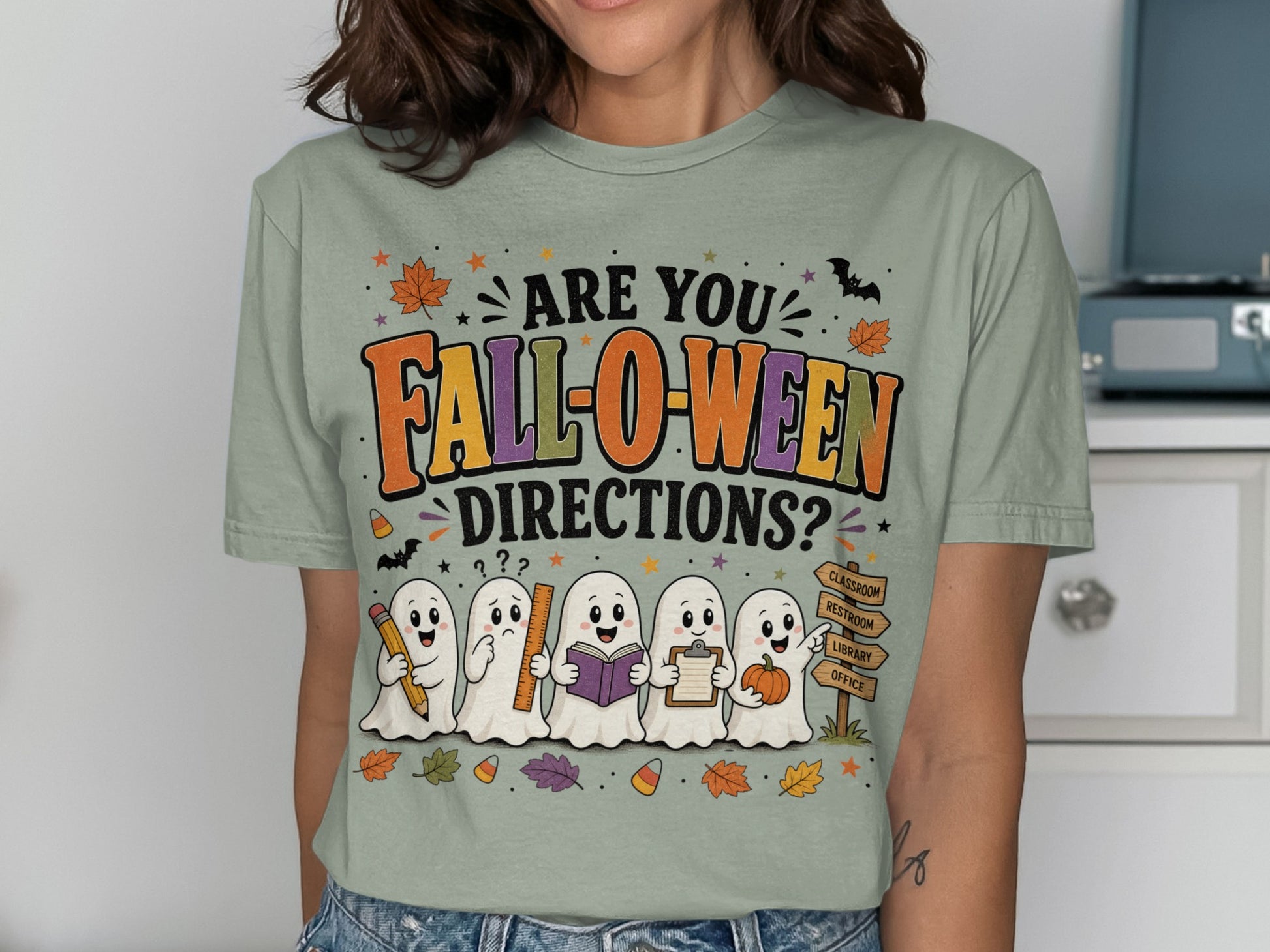 T-shirt with ghosts holding school supplies and text "Are you Fall-o-ween Directions?".