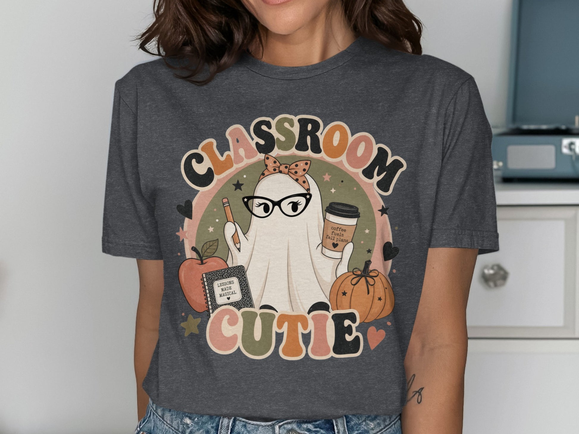 Ghost wearing glasses and holding coffee cup on t-shirt with text Classroom Cutie.