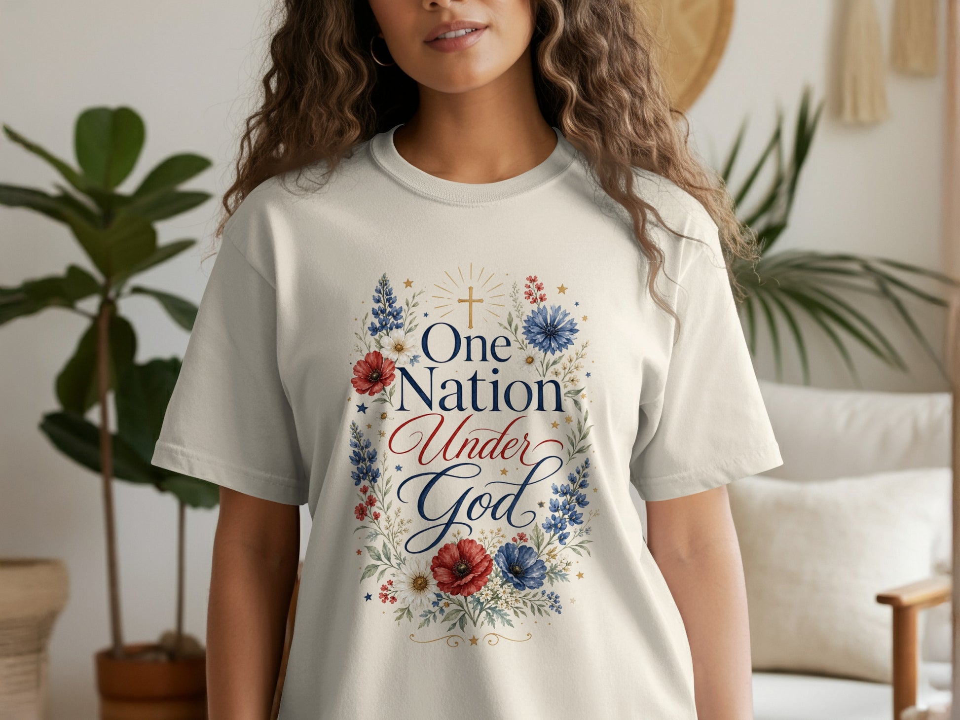 Cream t-shirt with floral wreath design and "One Nation Under God" text.