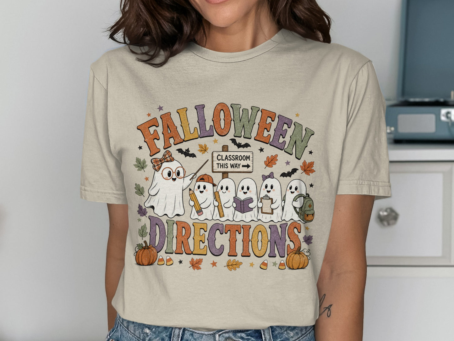 T-shirt graphic: "Falloween Directions" with ghosts as students and a ghost teacher.