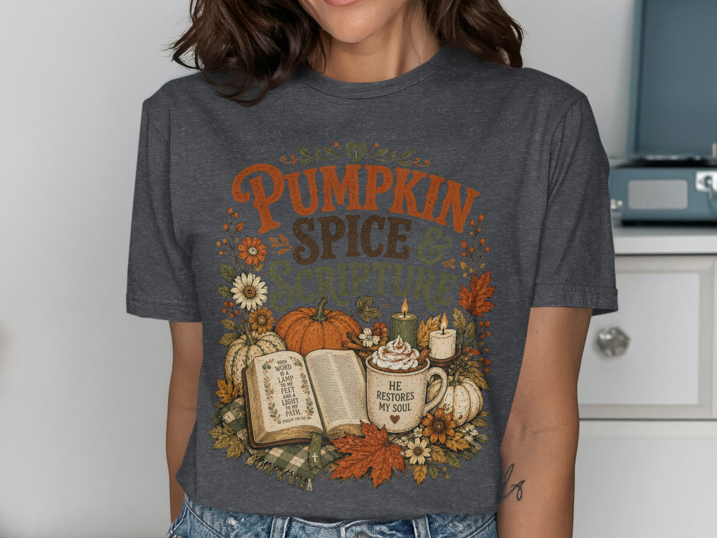 Dark gray t-shirt with "Pumpkin Spice & Scripture" text and fall harvest design.