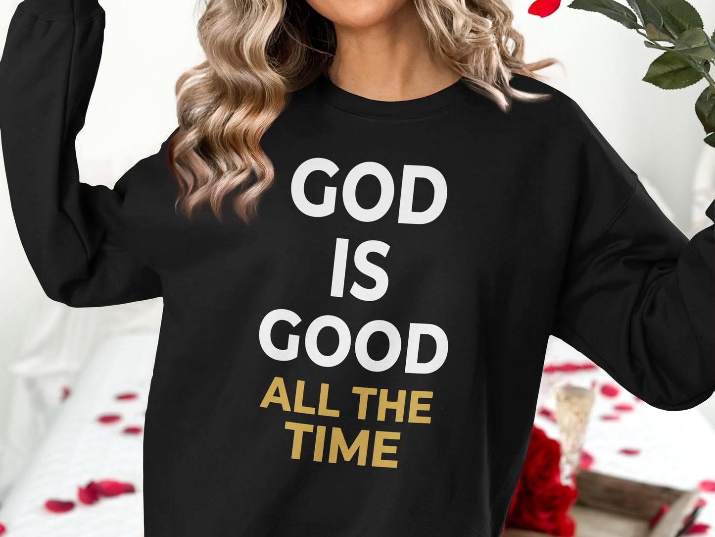 Black sweatshirt with "GOD IS GOOD ALL THE TIME" text in white and gold.