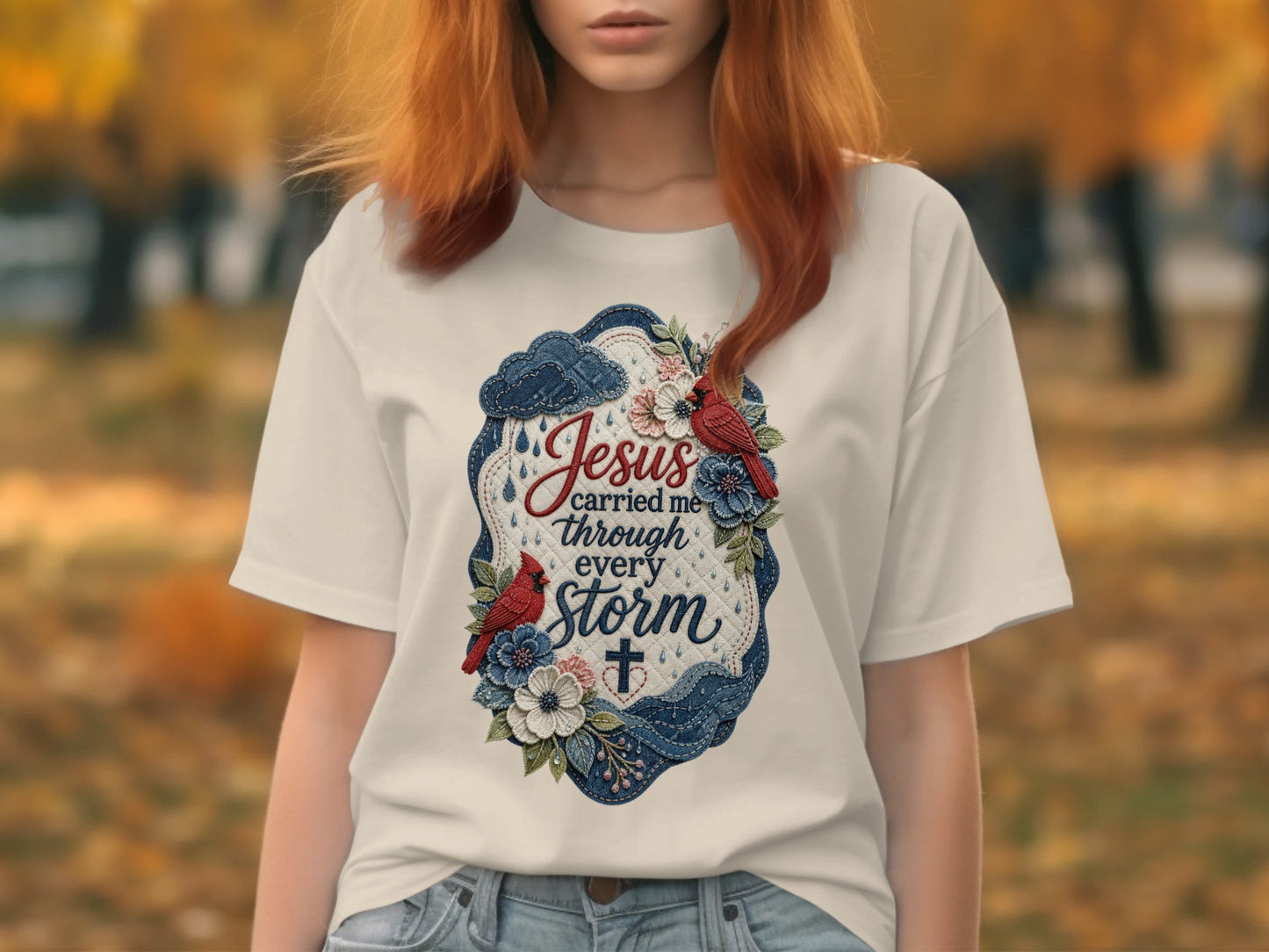 White t-shirt with "Jesus carried me through every storm" text and floral accents.