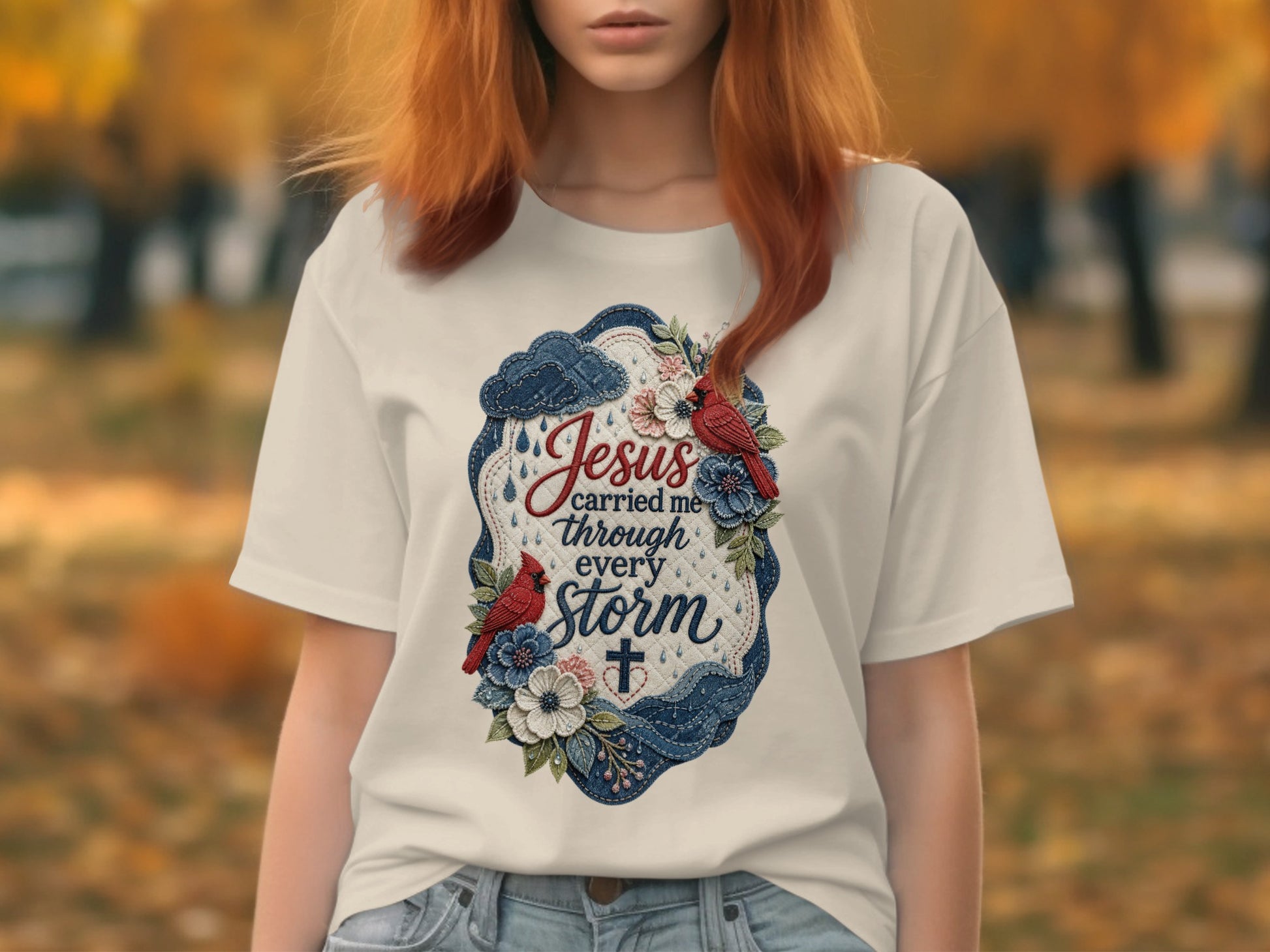 White t-shirt with "Jesus carried me through every storm" text and floral accents.