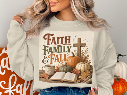 Sweatshirt with "Faith Family & Fall" graphic, pumpkins, cross, and open Bible.