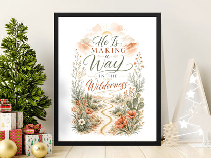 Framed artwork with text "He Is Making a Way In The Wilderness" and desert wildflowers.
