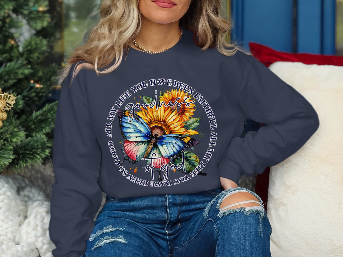 Dark blue sweatshirt with butterfly, sunflower, and text design.
