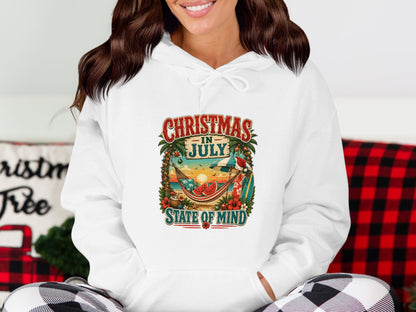White hoodie with "Christmas in July" tropical graphic.
