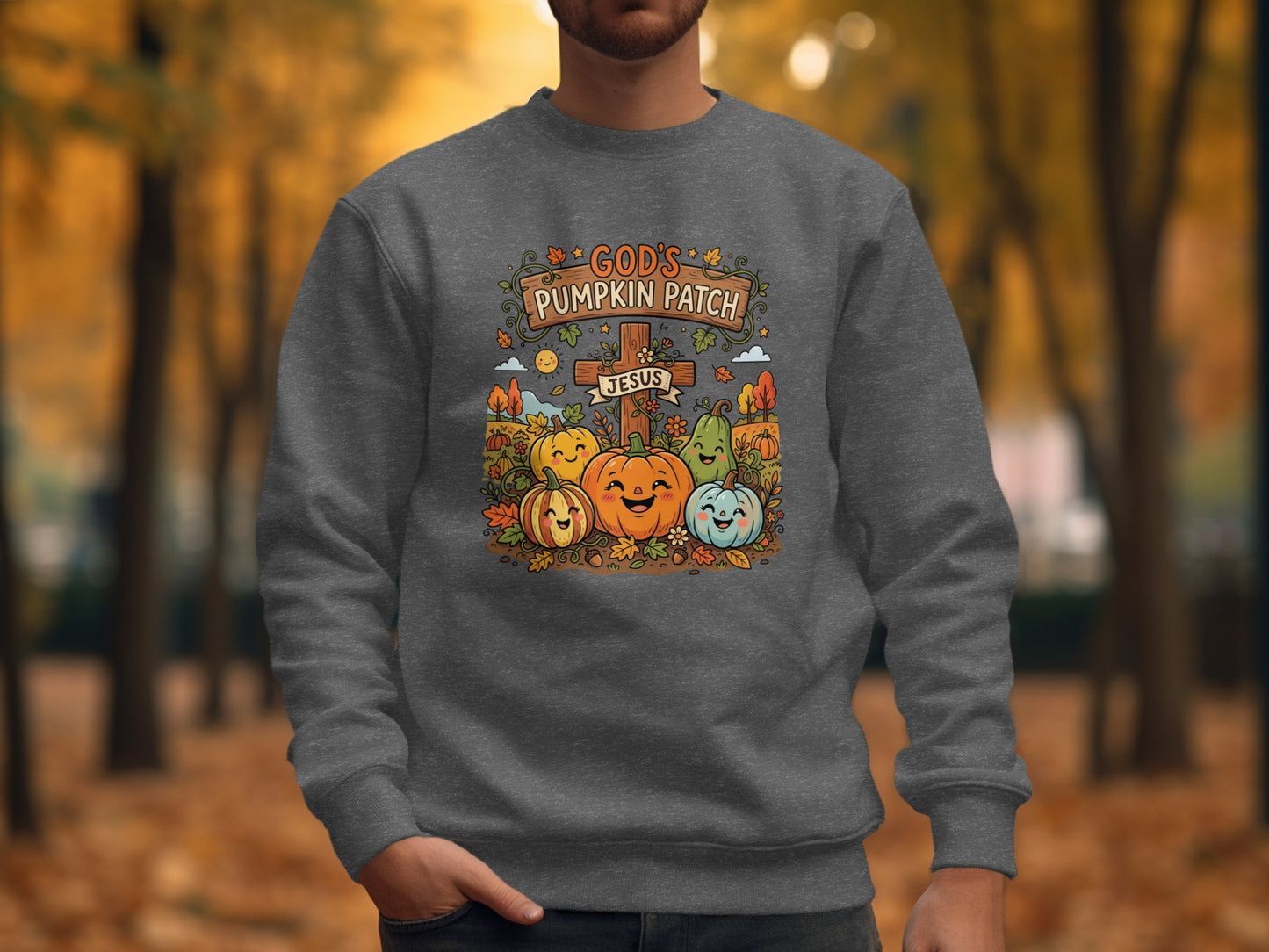 God's Pumpkin Patch graphic on grey sweatshirt with smiling pumpkins and cross.