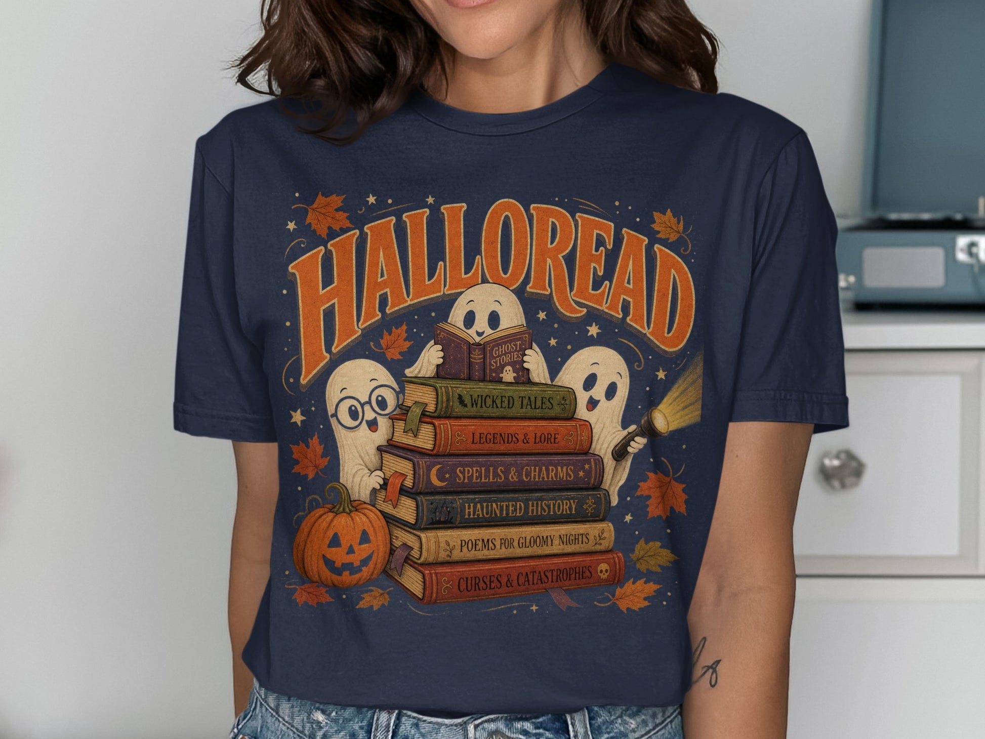 Halloween t-shirt with ghosts reading books titled "Halloread" and spooky themes.