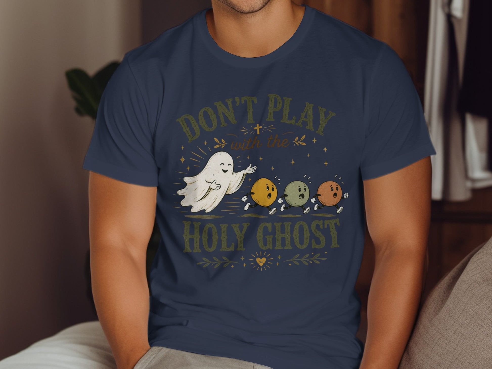 T-shirt with "Don't Play with the Holy Ghost" text and cartoon ghosts.