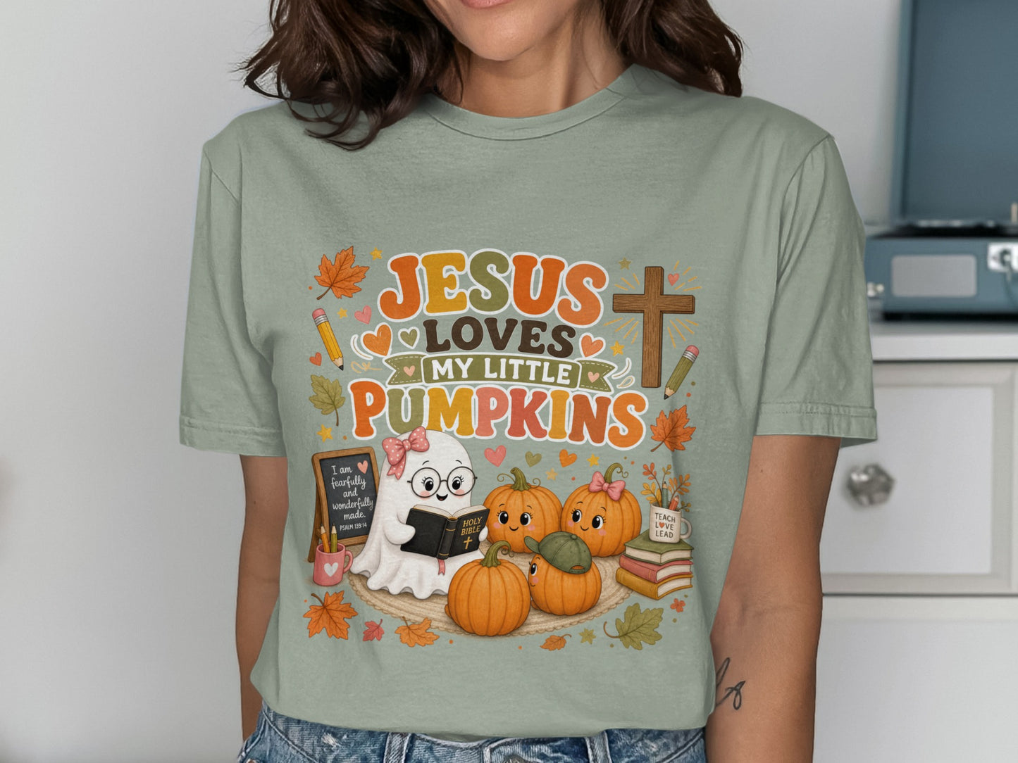 Jesus Loves My Little Pumpkins with ghost, pumpkins, and books graphic.