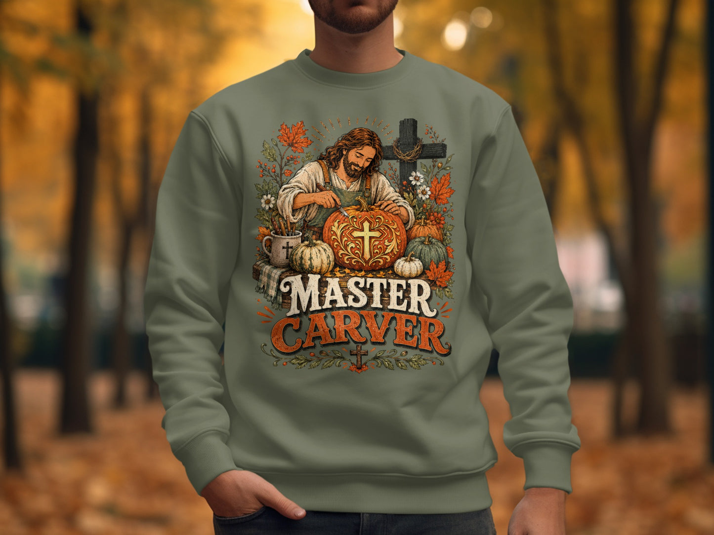 Jesus carving pumpkins with "Master Carver" text on sweatshirt.