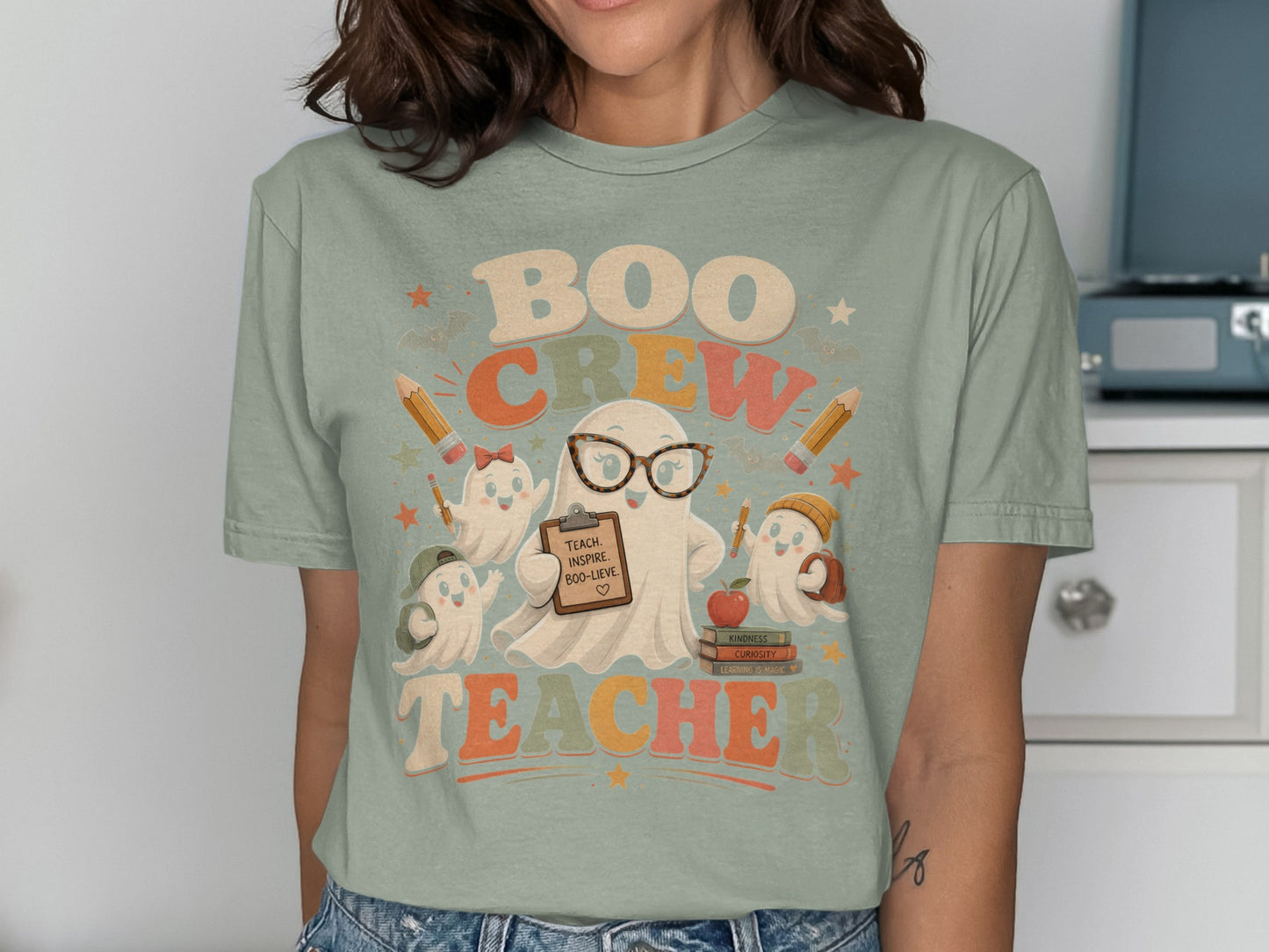 Ghosts in glasses and hats with pencils and books. "Boo Crew Teacher" text.